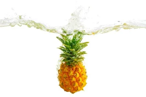 Fresh pineapple splash in water Stock Photos
