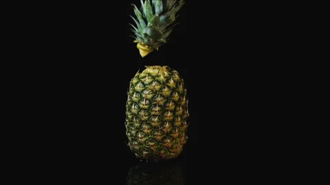 Fresh pineapple stand on black background. Stock Footage 113175542
