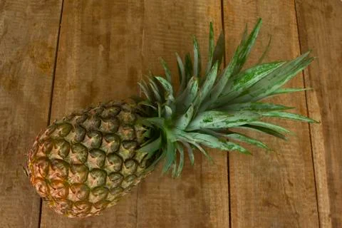 Fresh pineapple  on wood table Stock Photos