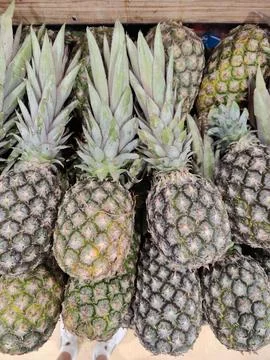 Fresh pineapples at a market Stock Photos