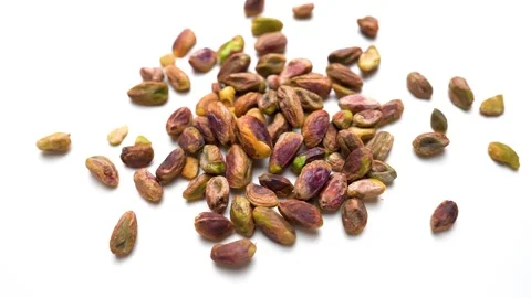 Fresh pistachio nuts view on white table background Stock Footage 282848221