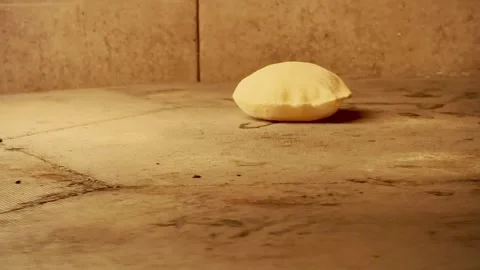 Fresh Pita Bread Inflating in Stone Oven Industrial with Burning Flame Stock Footage 333726037
