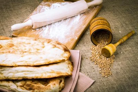 Fresh pita bread isolated on sacking background Fotos de archivo