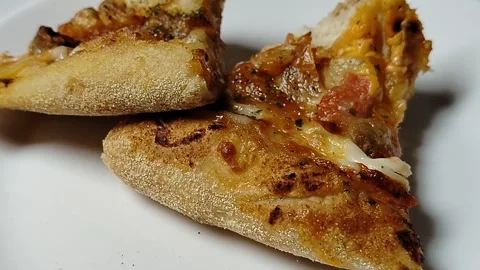Fresh pizza slice on a white plate, appetizing fast food with melted cheese  Stock-Footage 332320550