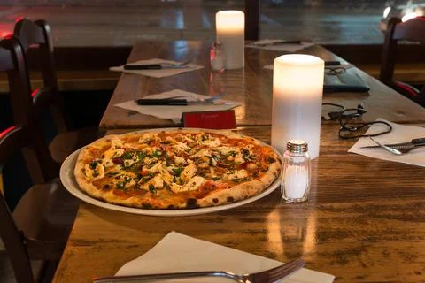 Fresh pizza on the table Stock Photos