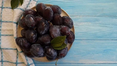 Fresh plum on wooden background slow motion Stock Footage 95882953