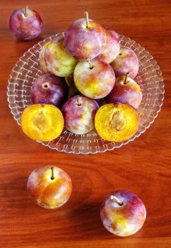 Fresh plums on table Stock Photos
