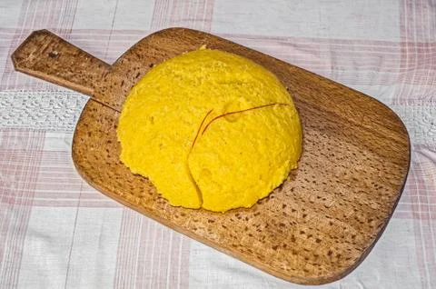 Fresh polenta cut with a red string Stock Photos