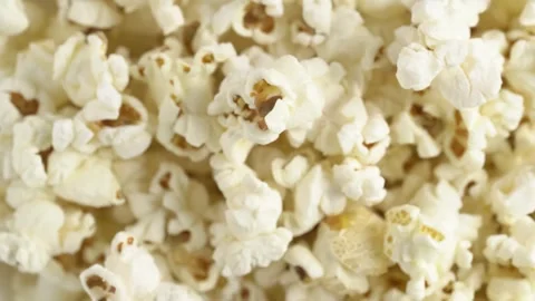 Fresh popcorn closeup. Pop corn background. Macro footage of sweet popcorn Stock Footage 253997809