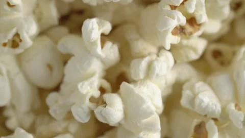 Fresh popcorn closeup rotating. Pop corn background. Macro footage of sweet.. Video stock 253997823