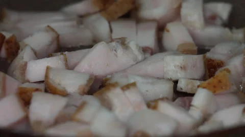 Fresh Pork Fat Cubes Rendering in a Hot Skillet for Delicious Lard Production Stock Footage 339631182
