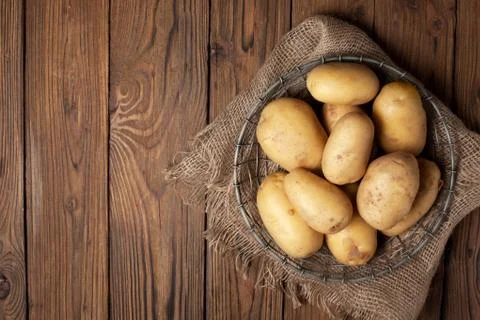 Fresh potatoes in basket Stock Photos