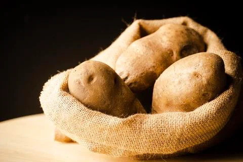 Fresh Potatoes on a rag Stock Photos