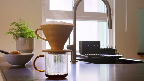 Fresh Pour Over Coffee Dripping in Sunlit Kitchen | Morning Brewing Process Stock-Footage 335880646