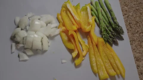 Fresh Prepped Vegetables on a Cutting Board Stock Footage 335347525