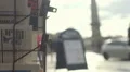 Fresh press with breaking news at newspaper shop, active urban life continues HD Footage