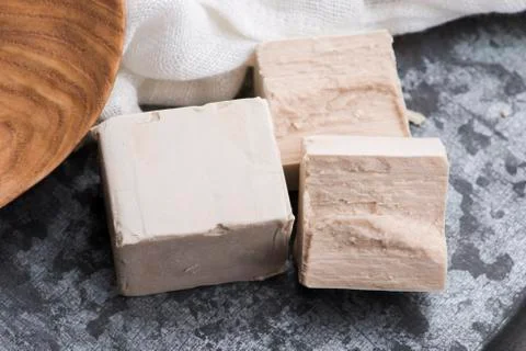Fresh pressed yeast serving board, selective focus Stock Photos