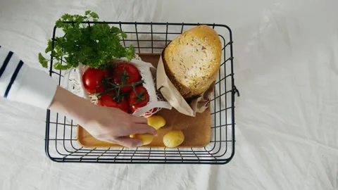 Fresh Produce and Bread Being Placed into Market Shopping Basket Stock Footage 339111317