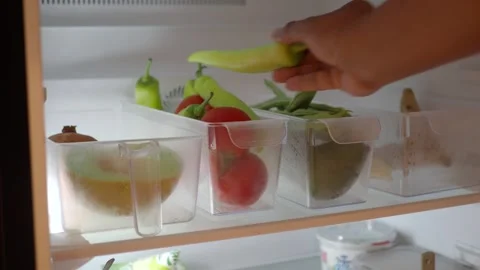 Fresh produce neatly organized in refrigerator Stock Footage 300079945