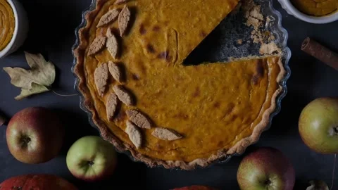 Fresh pumpkin pie. Pie on a brown wooden table. Stock Footage 157504610