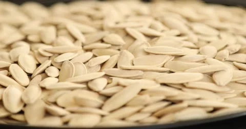 Fresh pumpkin seeds rotating 5 Stock Footage 140413992