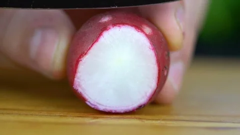 Fresh radish is cut Stock Footage 85225641
