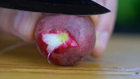 Fresh radish is cut HD Video stock 85225736
