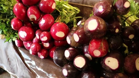 Fresh radish at a vegetable stall Stock Footage 127384681