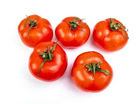 Fresh rape tomatoes on a table. Flat lay Stock Photos