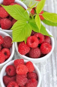 Fresh raspberries with leaf Stock Photos