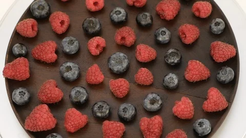 Fresh Raspberry And Blueberry Rotating on wooden plate Stock-Footage 116207188