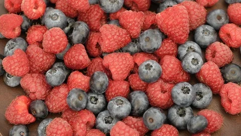 Fresh Raspberry And Blueberry Rotating Video stock 116207259