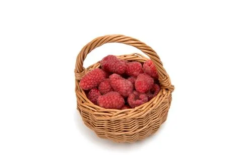 Fresh raspberry in a basket isolated Stock Photos