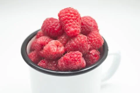 Fresh raspberry berry in a mug Stock Photos
