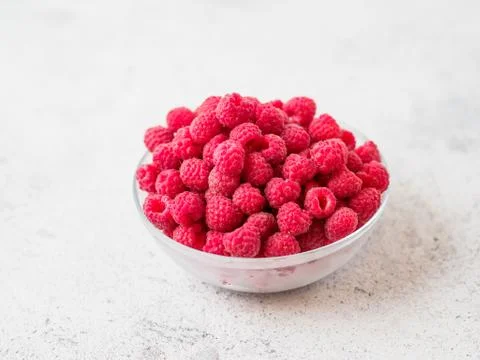 Fresh raspberry in the bowl. Stock Photos