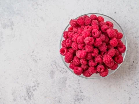 Fresh raspberry in the bowl. Stock Photos