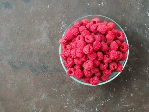 Fresh raspberry in the bowl. Stock Photos