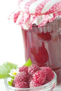 Fresh raspberry with jam jar Stock Photos