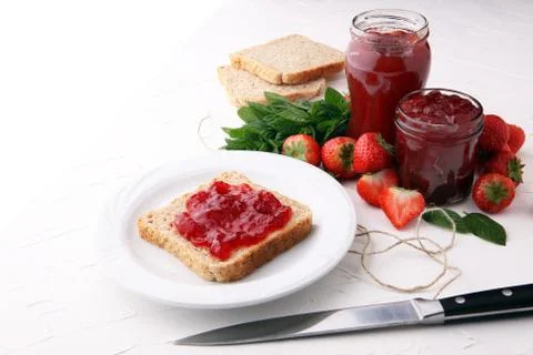 Fresh raspberry jam with toast or bread for breakfast Stock Photos