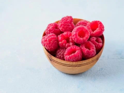 Fresh raspberry in the plate. Stock Photos