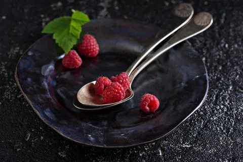 Fresh raspberry in a vintage spoon Stock Photos