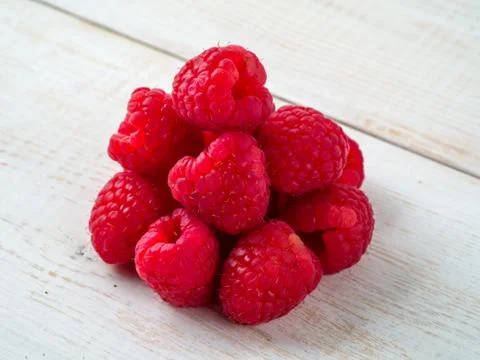 Fresh raspberry on wooden background. Stock Photos