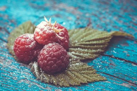 Fresh raspberry on a wooden table Stock Photos