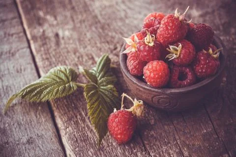 Fresh raspberry on a wooden table Stock Photos