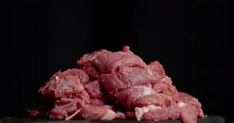 The fresh raw beef cut into pieces slowly rotates. Stock Footage 139160356