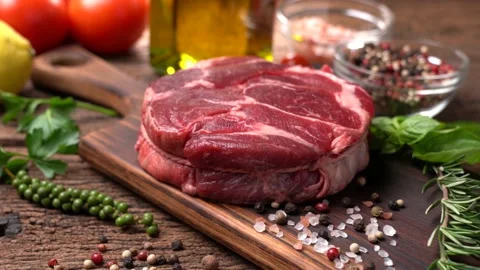 Fresh raw beef meat on a cutting board Stock Footage 152751455