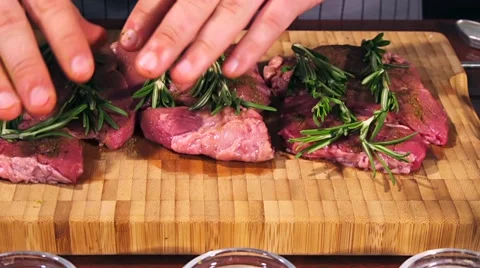 Fresh raw beef meat. Men seasons meat with oil, herbs and spice Stock Footage 66449283