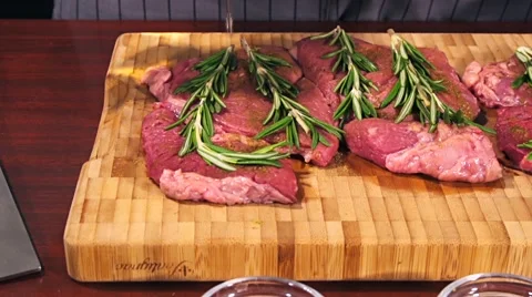 Fresh raw beef meat. Men seasons meat with oil, herbs and spice Stock Footage 66449434