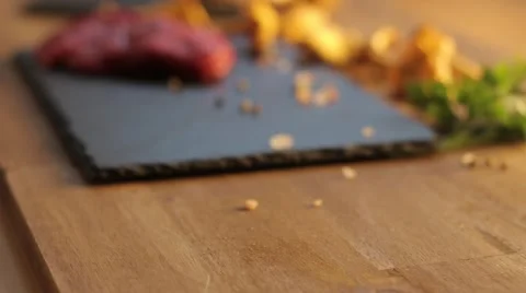 Fresh raw beef meat with peppercorns ready to grill, rotating Видео 68024252