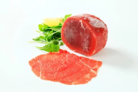Fresh raw beef steak with herbs Stock Photos
